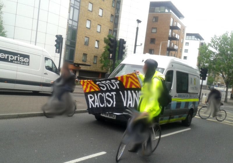 Cyclists surround immigration removal vans to stop racist raids